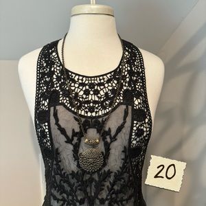 Long necklace with green stone.  .